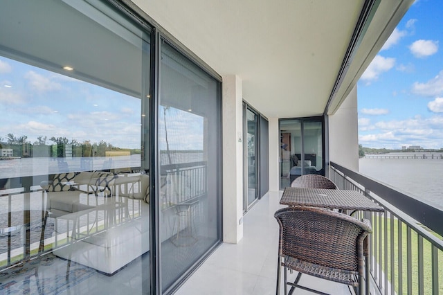 balcony featuring a water view