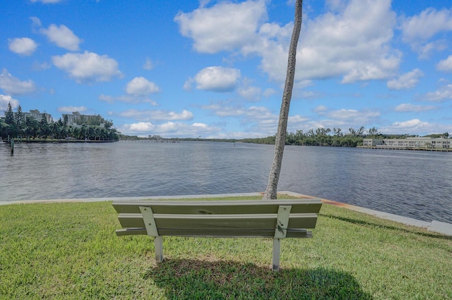 dock area featuring a yard and a water view