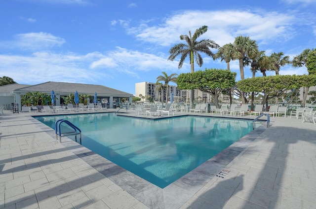 view of swimming pool featuring a patio area