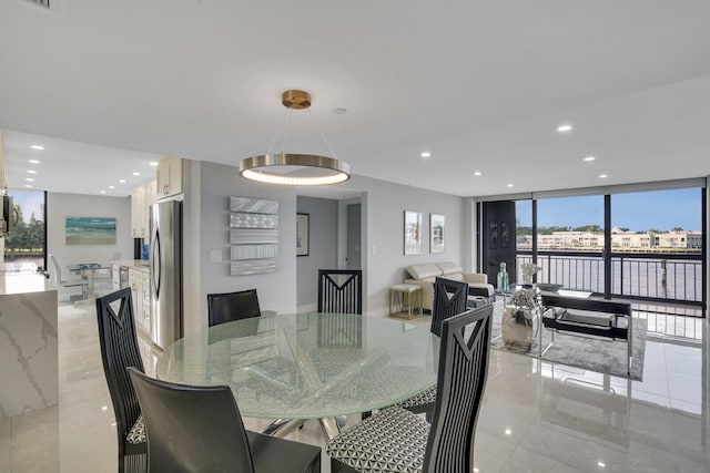 dining area with a wall of windows