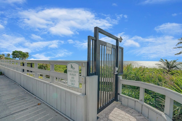 exterior space featuring a view of the beach and a water view