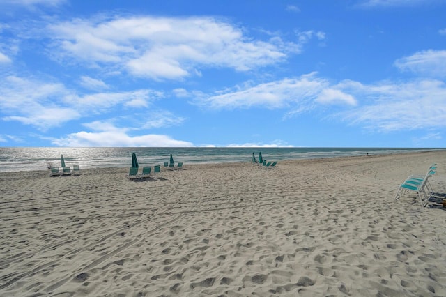 view of home's community with a view of the beach and a water view