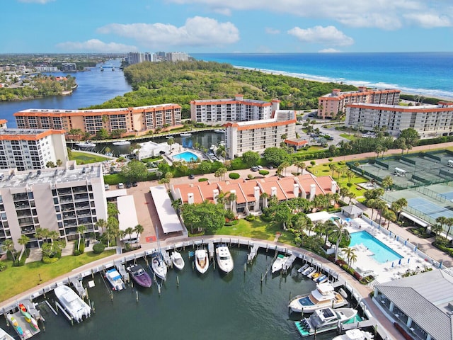 birds eye view of property with a water view