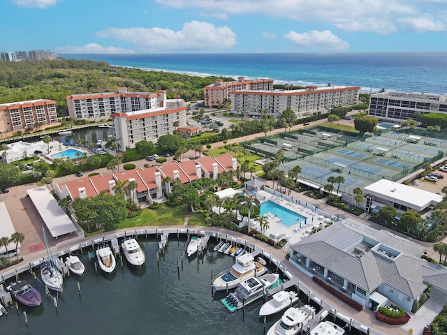 birds eye view of property with a water view