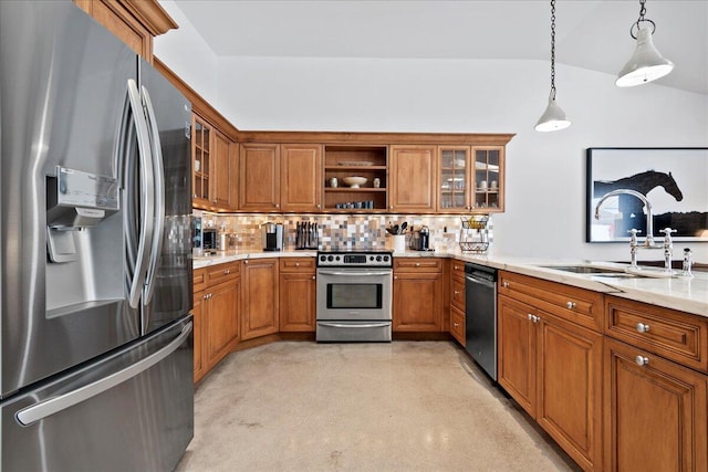 kitchen featuring appliances with stainless steel finishes, backsplash, sink, decorative light fixtures, and lofted ceiling