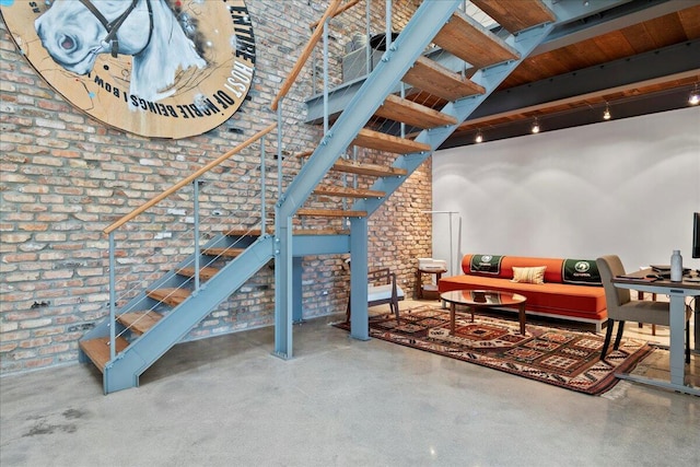 interior space featuring brick wall