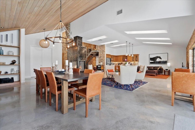 dining space with a skylight, high vaulted ceiling, wooden ceiling, and a notable chandelier