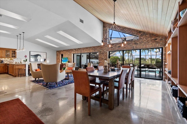 dining space with sink, high vaulted ceiling, wooden ceiling, and brick wall