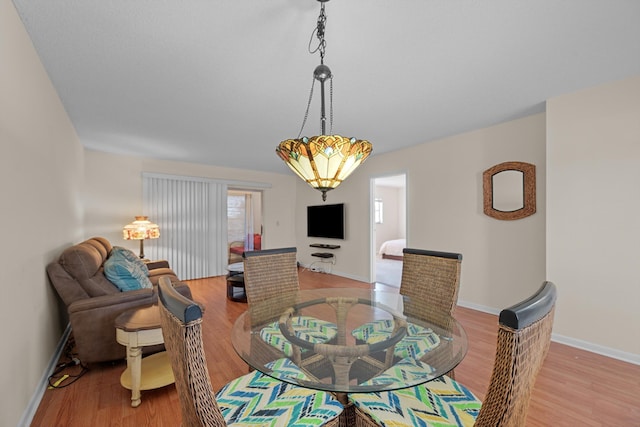 dining area with light wood-type flooring