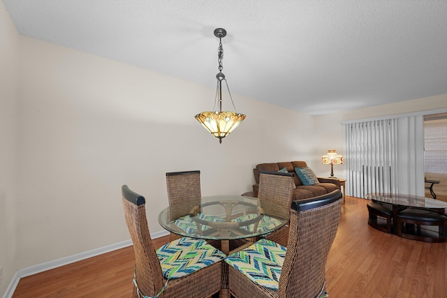 dining area featuring hardwood / wood-style flooring