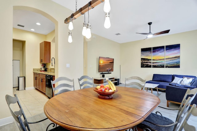 dining area with sink, ceiling fan, and light tile patterned floors