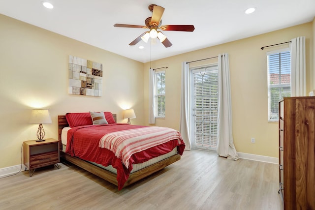 bedroom featuring light wood-type flooring and ceiling fan