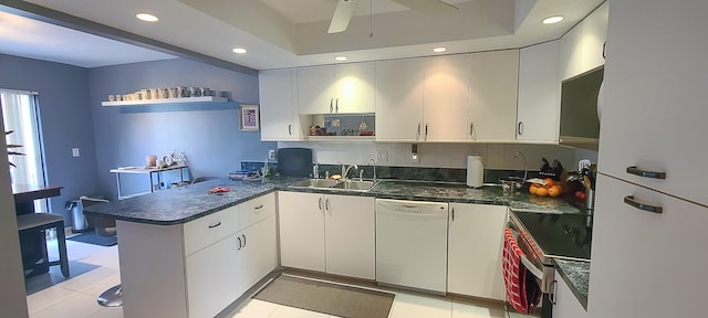 kitchen featuring kitchen peninsula, white cabinets, white dishwasher, and electric range oven