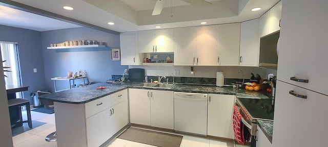 kitchen featuring open shelves, a sink, a peninsula, white appliances, and a ceiling fan