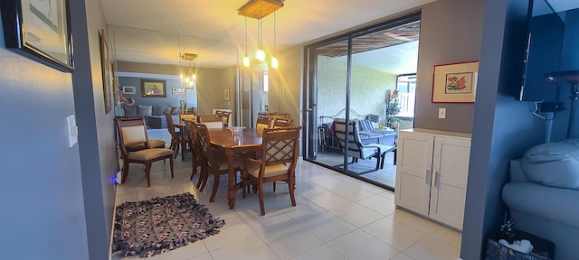 dining space featuring light tile patterned floors