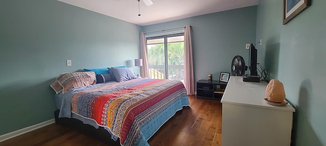 bedroom featuring dark wood-type flooring and ceiling fan