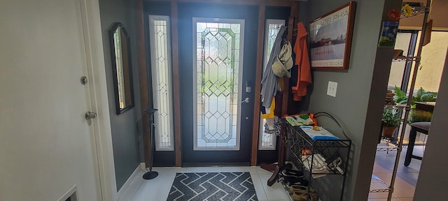 entrance foyer with light tile patterned floors