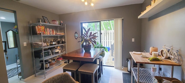 tiled dining area with baseboards