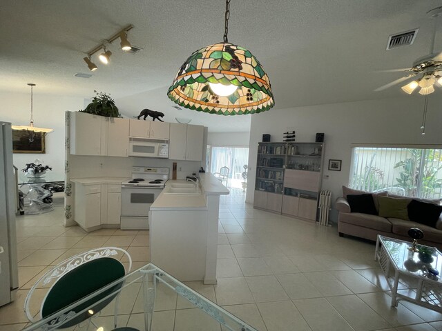 carpeted dining room with ceiling fan and ornamental molding