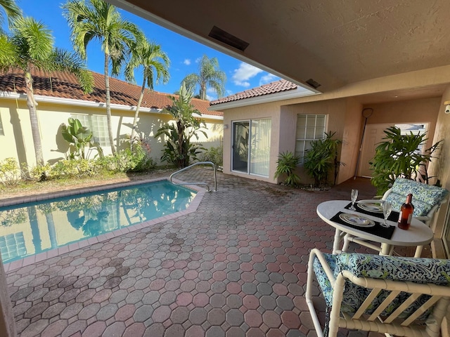 view of swimming pool featuring a patio area