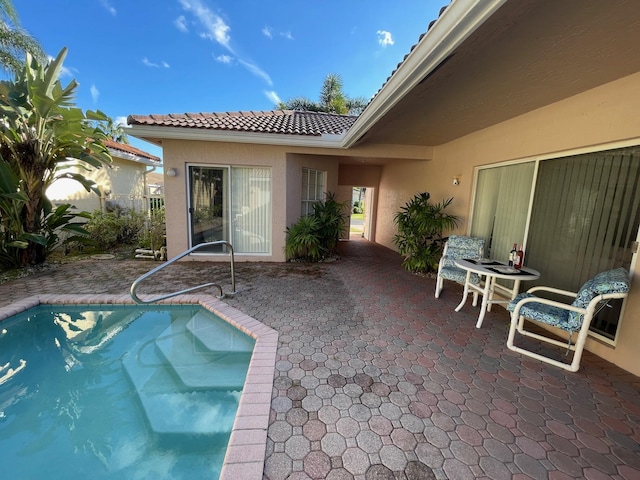 pool with a patio area