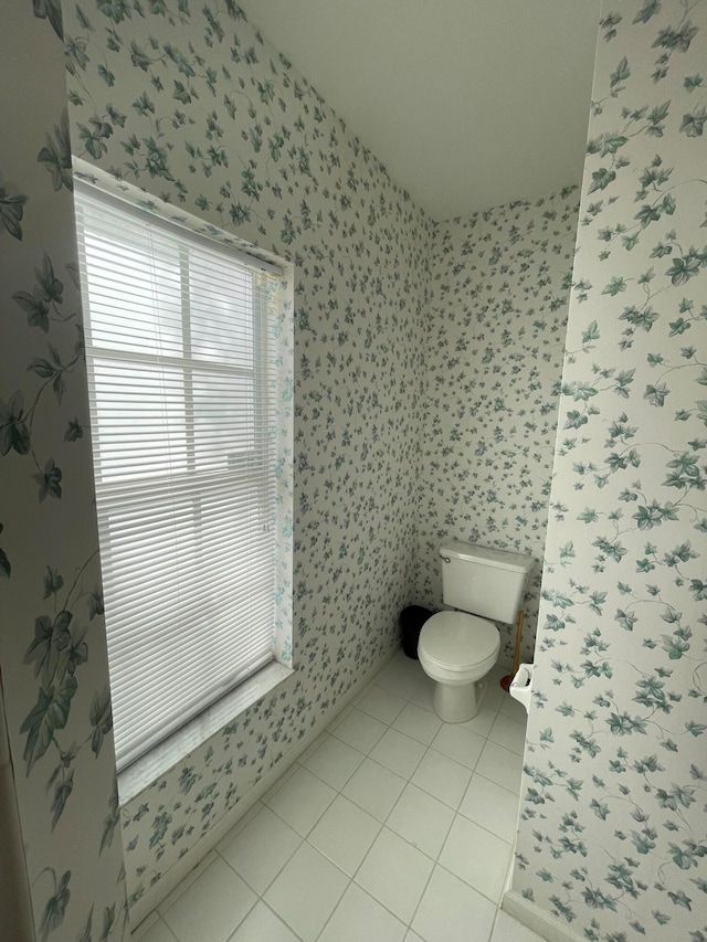 bathroom featuring toilet and tile patterned floors