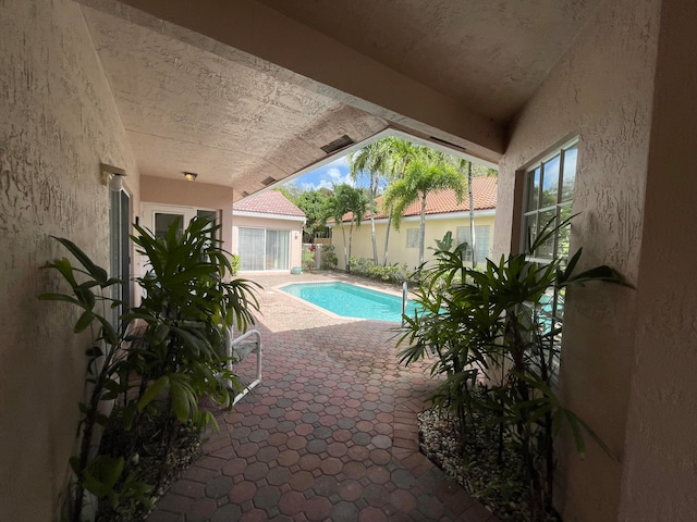 view of swimming pool featuring a patio