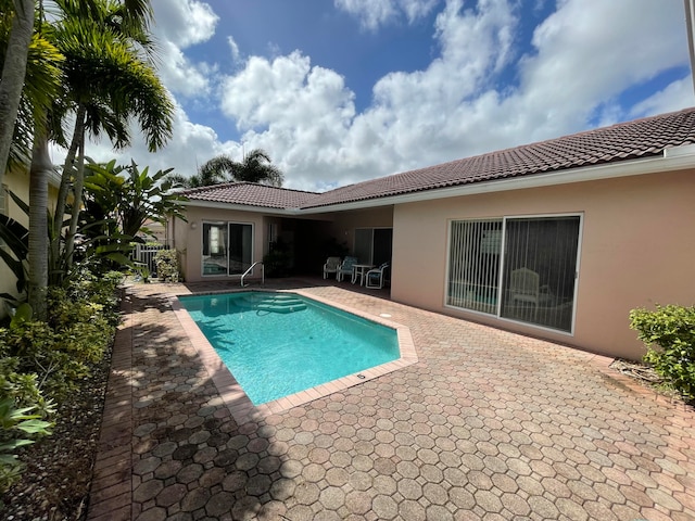 view of swimming pool with a patio