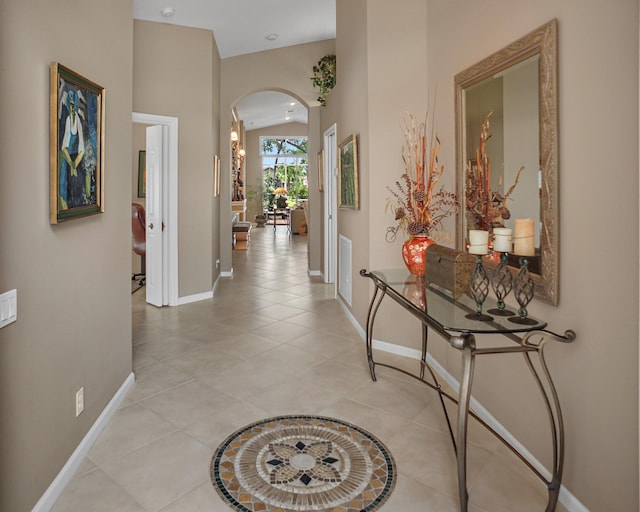 hall with light tile patterned flooring