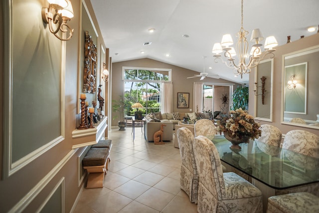 tiled dining area featuring lofted ceiling and ceiling fan with notable chandelier