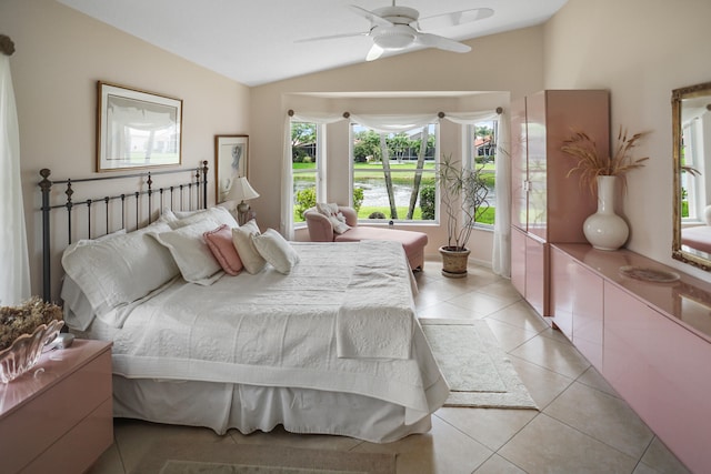 bedroom with vaulted ceiling, multiple windows, and ceiling fan