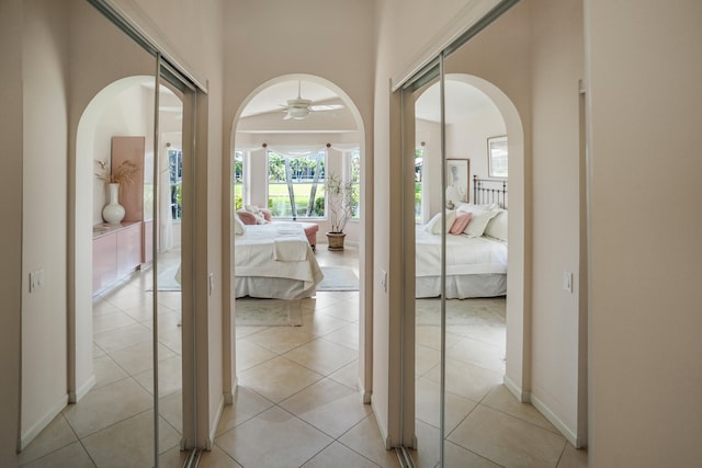 hall featuring light tile patterned flooring