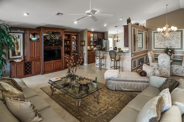 living room featuring vaulted ceiling, ceiling fan with notable chandelier, and light tile patterned floors