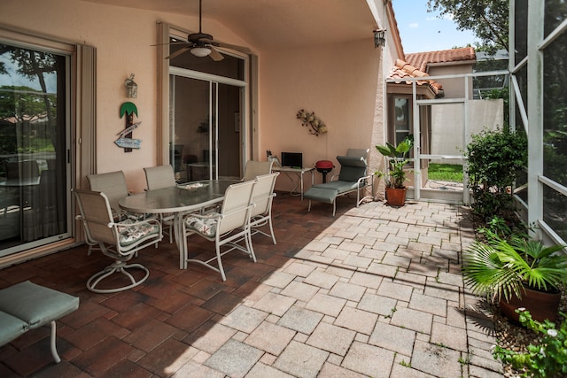 view of patio / terrace with a lanai and ceiling fan