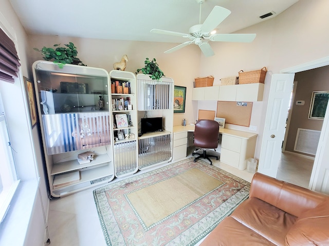 home office featuring built in desk and ceiling fan