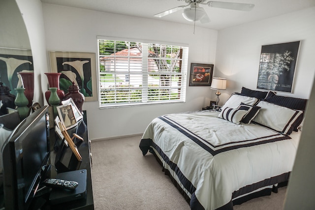 bedroom with light carpet and ceiling fan