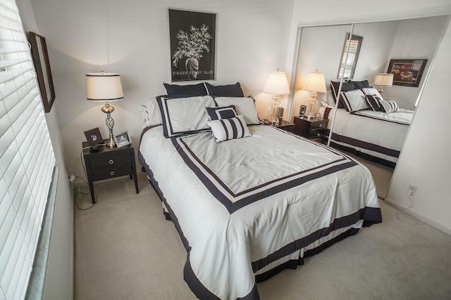 carpeted bedroom featuring a closet