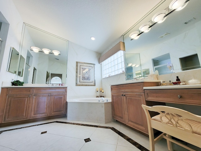 bathroom featuring vanity, a textured ceiling, tile patterned flooring, and plus walk in shower