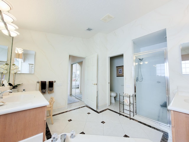 bathroom with a shower with door, a textured ceiling, toilet, tile patterned floors, and vanity