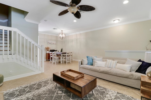 tiled living room with crown molding and ceiling fan with notable chandelier