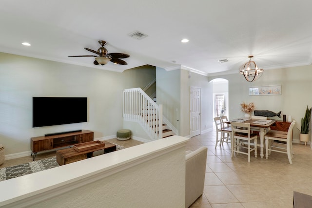 living room featuring crown molding, ceiling fan with notable chandelier, and light tile patterned floors