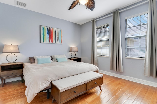 bedroom with light hardwood / wood-style flooring and ceiling fan