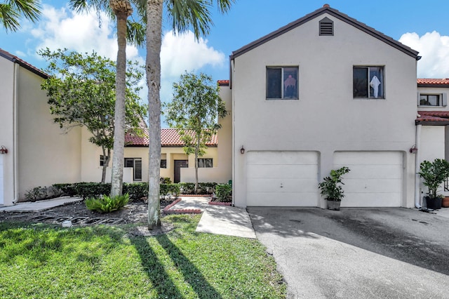 mediterranean / spanish-style home with a garage