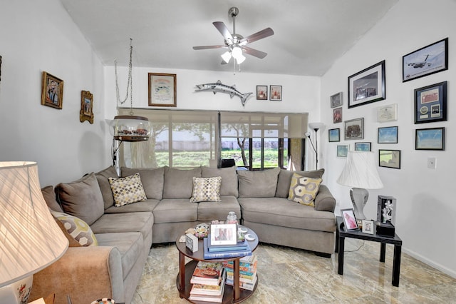 living room featuring ceiling fan and lofted ceiling