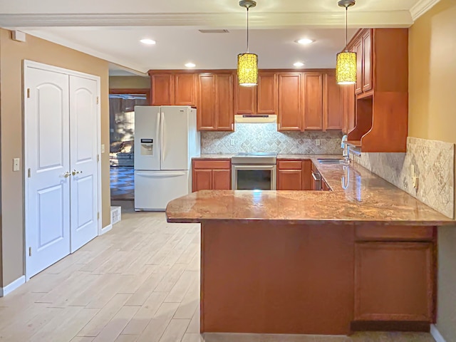 kitchen with white fridge with ice dispenser, stainless steel range oven, kitchen peninsula, decorative light fixtures, and ornamental molding