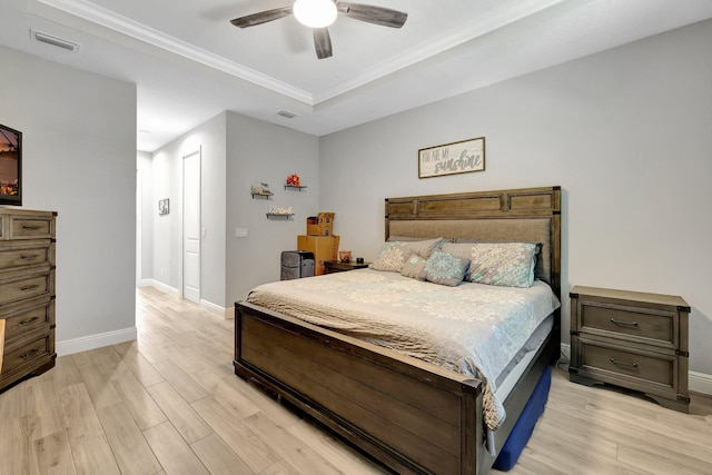 bedroom with light hardwood / wood-style floors and ceiling fan