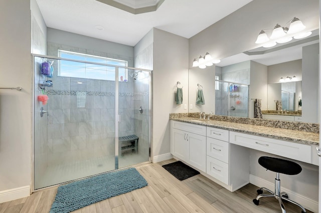 bathroom featuring vanity, an enclosed shower, and hardwood / wood-style floors