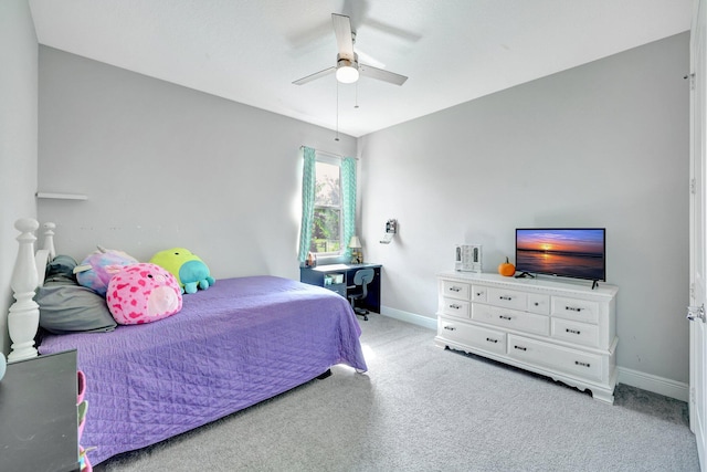 bedroom featuring ceiling fan and light carpet