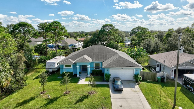 view of front facade featuring a front yard and a garage