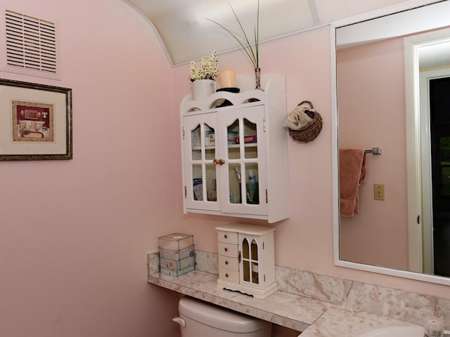 1035 Newport H, Deerfield Beach, FL 33442 - bathroom featuring vaulted ceiling and vanity